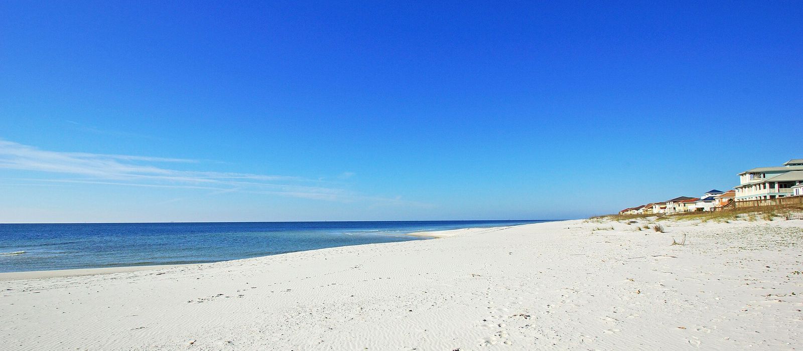 White sand beach and Gulf of Mexico shoreline at Gulf Shores, Alabama